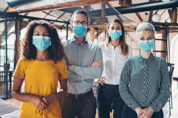 Group of business persons with face masks