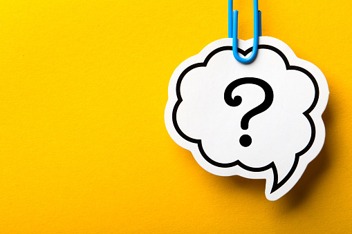 Question Mark Speech Bubble paper is isolated on the yellow background.