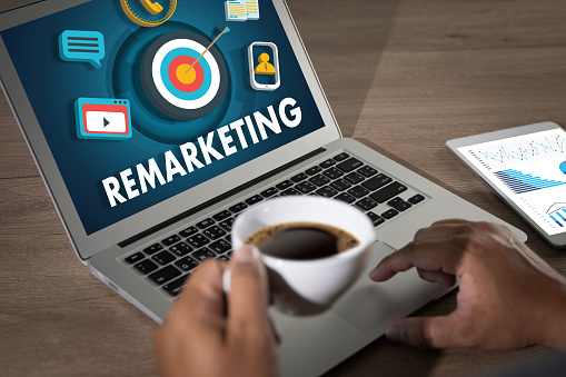 Remarketing Business team hands at work with financial reports business and social media marketing, content