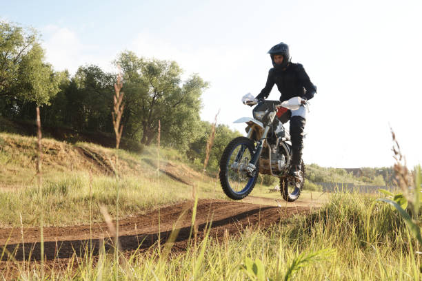 istock Riding motorbike on hills 1257697136