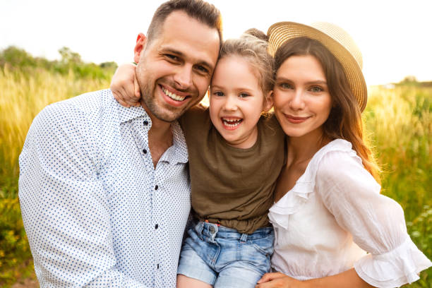 istock Cute family spending time together looking at camera 1257704133