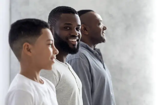 Photo of Role of Men In Families. Black Man Posing With Son And Father