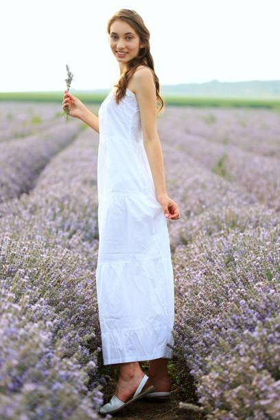 istock Young girl in lavender field 1257704361