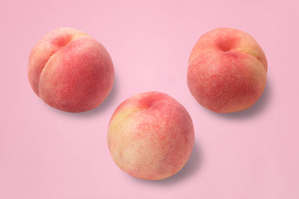 Three peaches Peaches grown in Yamanashi prefecture in Japan peach photos stock pictures, royalty-free photos & images
