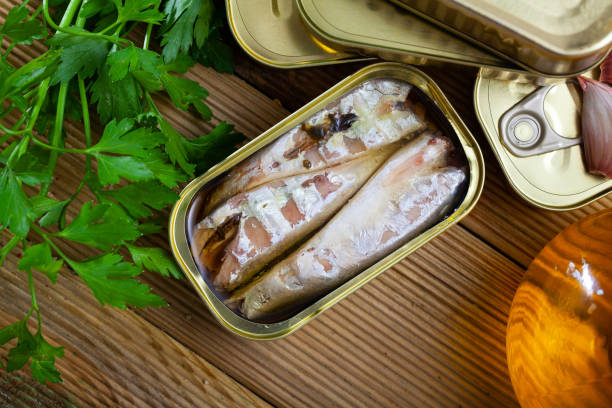 istock Preserved mackerel fish on wooden table 1257705544
