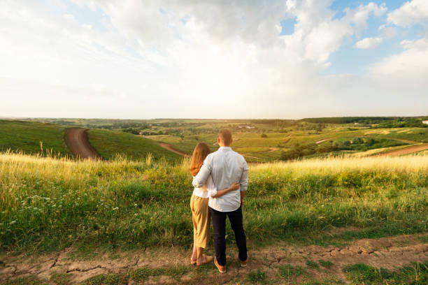 istock Happy family enjoying landscape outdoors, rear view 1257705672