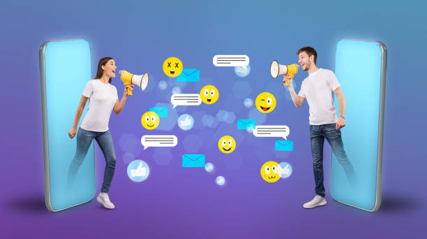 istock Young couple chatting using cell phones and loudspeakers 1257706613