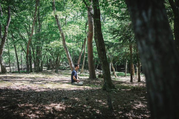istock Man doing yoga in the mountain 1257707404
