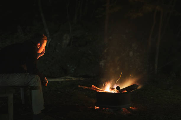 istock Man meditating in front of bonfire at night 1257707561