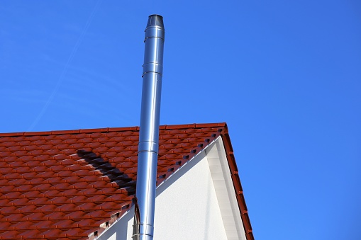 Stainless steel chimney on a new residential home
