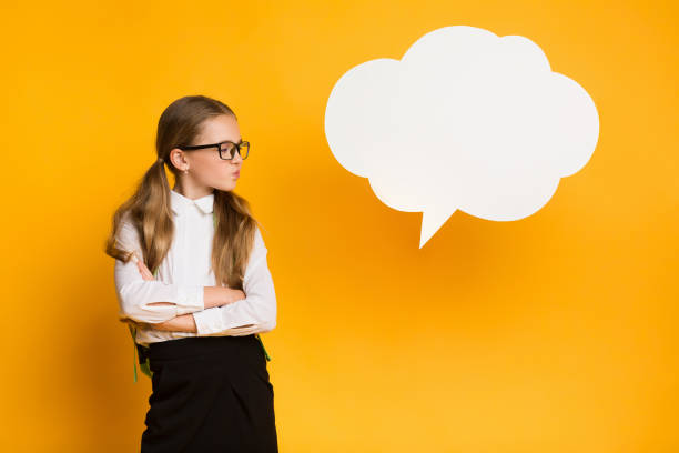 istock Discontented Schoolgirl Thinking Standing Near Speech Bubble, Mockup, Studio Shot 1257707851