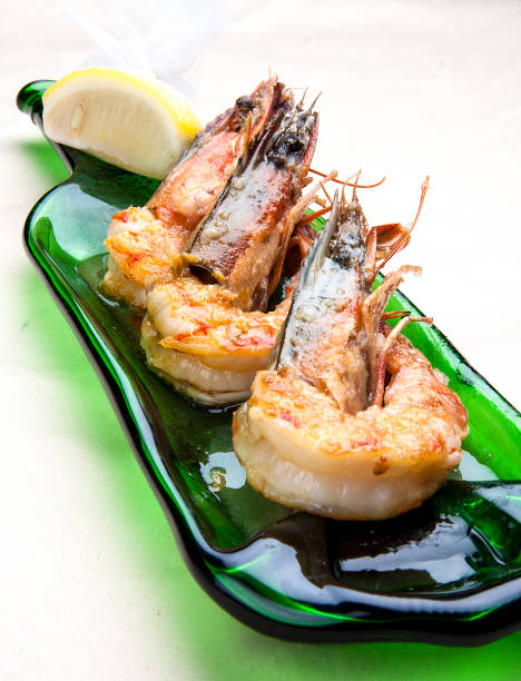 istock King prawns with wine sauce on white background 1257711909