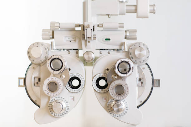 istock Phoropter close up view of ophthalmology, optometry, and optician clinical testing machine equipment against a white background 1257713715