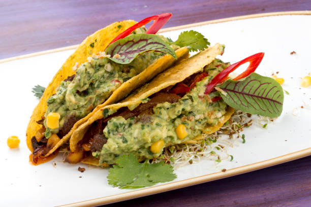 istock Taco. Corn tortilla with beef and guacamole with spices. 1257714675
