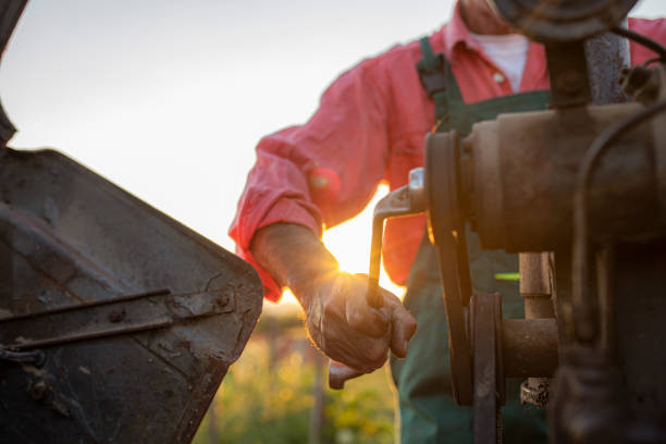 istock Farmer repairing tractor 1257714834