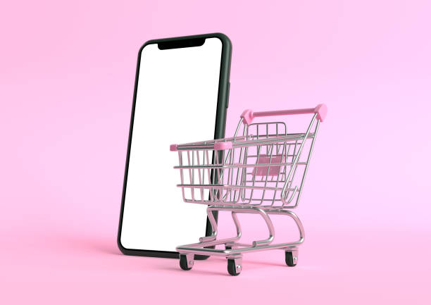 istock Shopping cart with empty smartphone screen on a pink background 1257716944