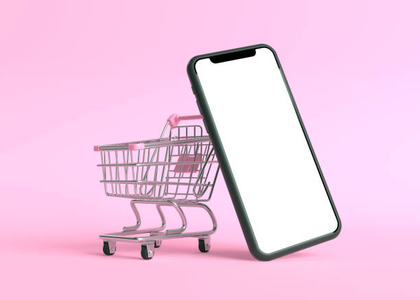 istock Shopping cart with empty smartphone screen on a pink background 1257716967