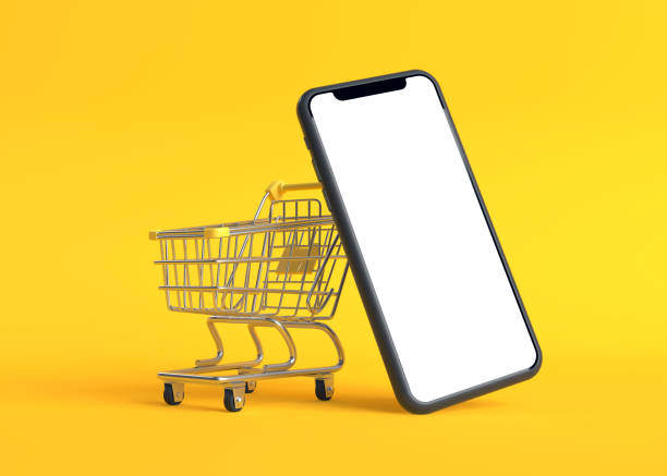 istock Shopping cart with empty smartphone screen on a yellow background 1257717000