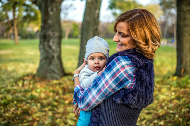 istock Happy mother and son playing outdoors 1257718318