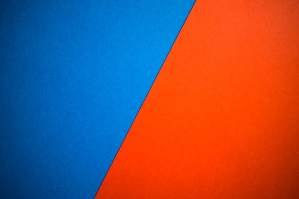 istock Blue and orange abstract background divided diagonally 1257719254
