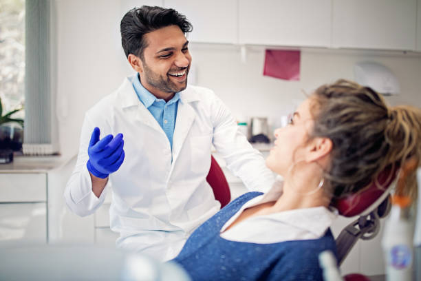 Dentist is working with patient in his office Dentist is working with patient in his office orthodontist consultation stock pictures, royalty-free photos & images