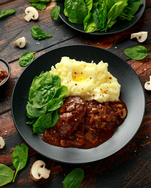 istock Salisbury Steak with mushroom gravy, mashed potatoes and spinach 1257722632