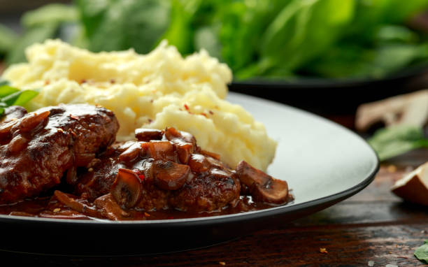 istock Salisbury Steak with mushroom gravy, mashed potatoes and spinach 1257722959