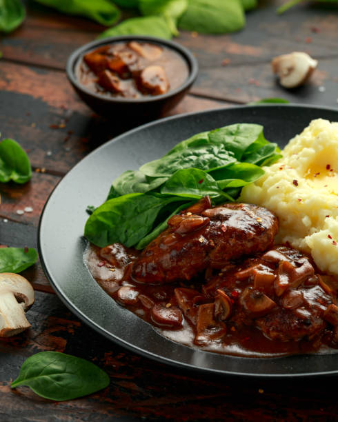 istock Salisbury Steak with mushroom gravy, mashed potatoes and spinach 1257722984