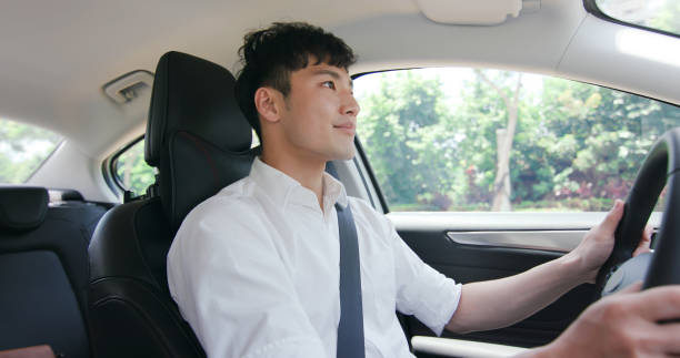 business asian man driving car