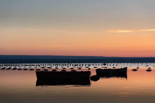 Mediterranean mussel farm in the Mar Piccolo of Taranto, Puglia, Italy stock photo