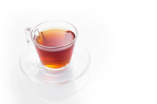 istock Black tea in a glass cup on a white background 1257726704