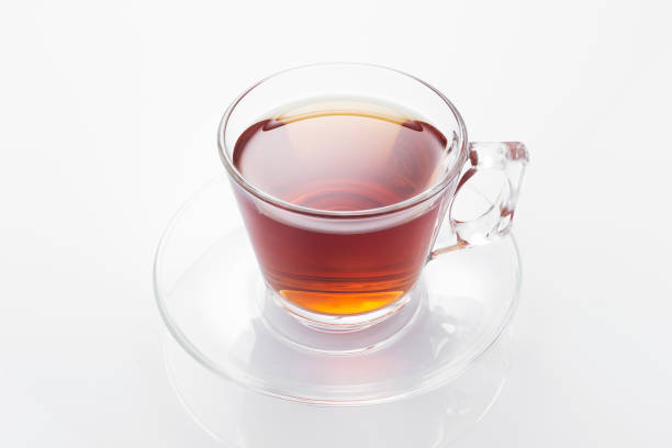 istock Black tea in a glass cup on a white background 1257726720