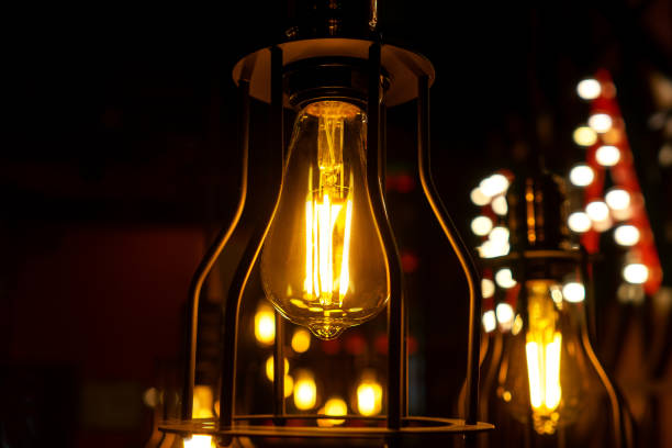 istock Minimalistic lamps in loft style. Yellow light. 1257727142