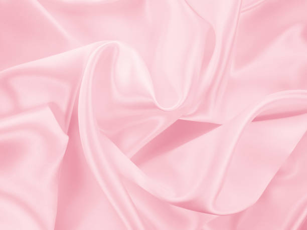 istock Beautiful elegant wavy light pink satin silk 1257727872