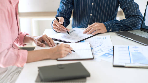 istock Business team working with plan on office desk with new startup project analyzing financial document data charts and graphs in Meeting and successful teamwork Concept 1257728237