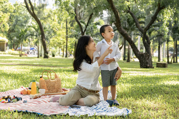 istock Mother and son at public park 1257729642