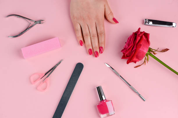 istock Woman's hand with finished nails. Manicure set of tools 1257734372