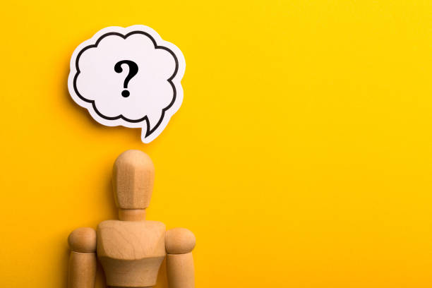 istock Wooden Man With Question Mark Speech Bubble 1257739396