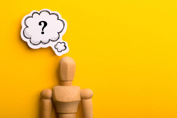 istock Wooden Man With Question Mark Speech Bubble 1257739397