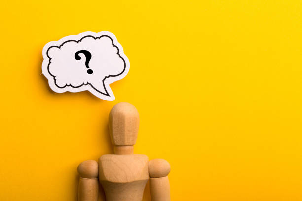 istock Wooden Man With Question Mark Speech Bubble 1257739400