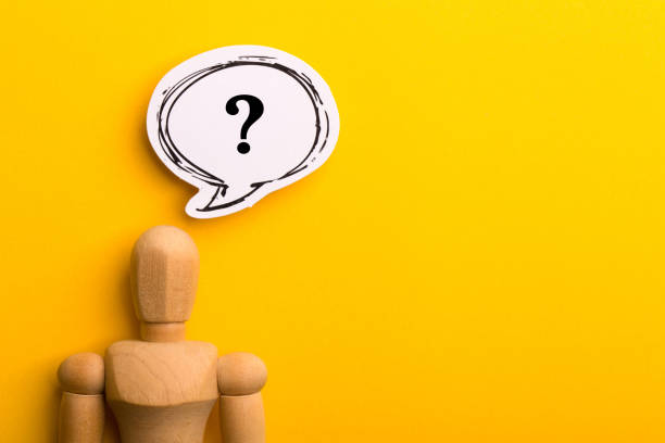 istock Wooden Man With Question Mark Speech Bubble 1257739403