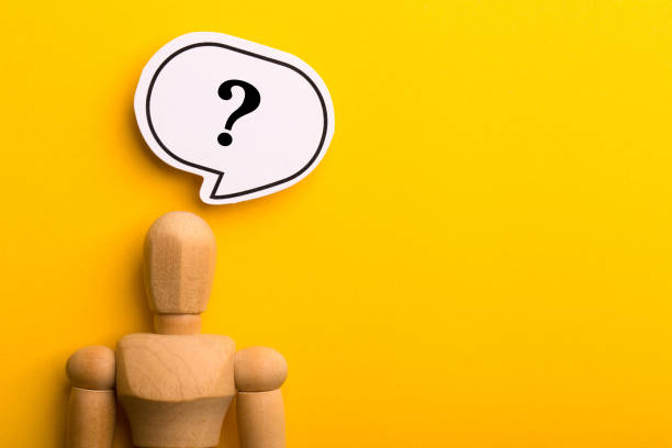 istock Wooden Man With Question Mark Speech Bubble 1257739408