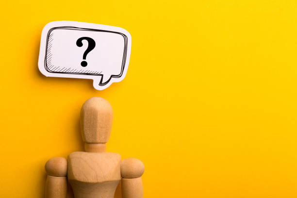 istock Wooden Man With Question Mark Speech Bubble 1257739412