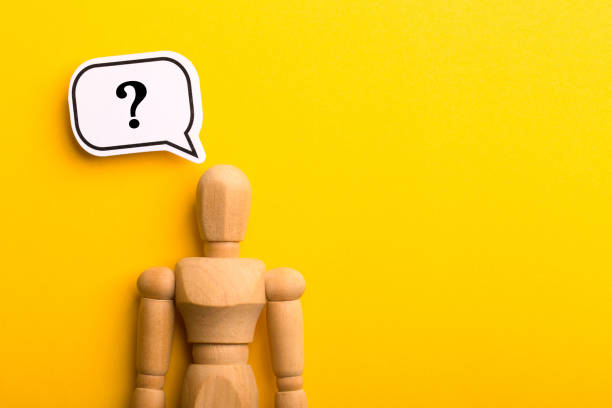 istock Wooden Man With Question Mark Speech Bubble 1257739415