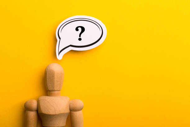 istock Wooden Man With Question Mark Speech Bubble 1257739423