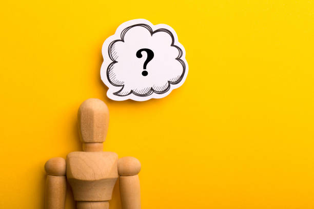 istock Wooden Man With Question Mark Speech Bubble 1257739436