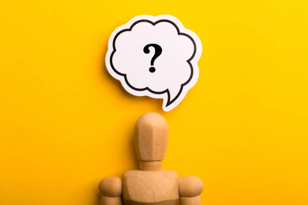 istock Wooden Man With Question Mark Speech Bubble 1257739451