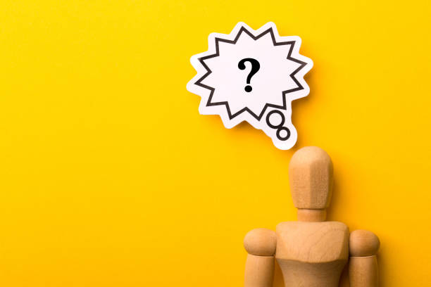istock Wooden Man With Question Mark Speech Bubble 1257739457