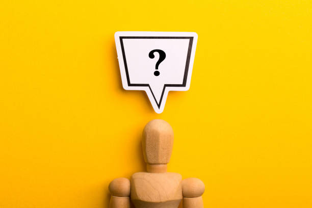 istock Wooden Man With Question Mark Speech Bubble 1257739459
