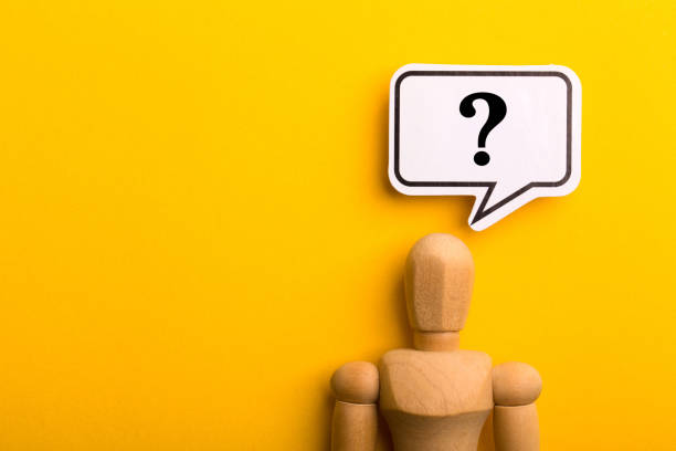 istock Wooden Man With Question Mark Speech Bubble 1257739462